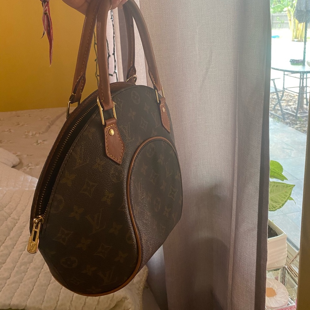 LV oval purse